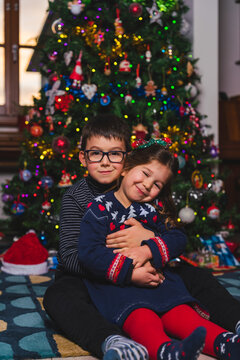 Affectionate Siblings Portrait for Christmas