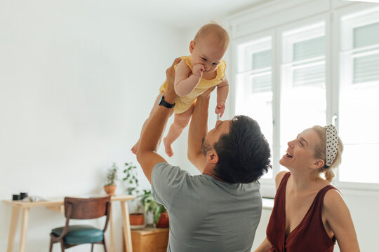 Caring Father Playing Some Games With His Kid Carefully