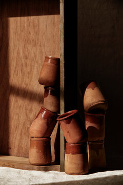 Handmade clay cups on a table
