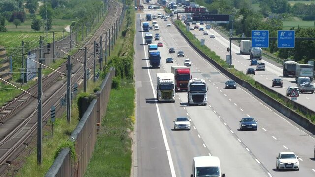 Weilbach, Germany - June 14, 2021: Large trucks and dense traffic on autobahn A3 near Wiesbadener Kreuz. The Bundesautobahn 3 (abbreviated as BAB 3 or A 3) is a highway in Germany that links the borde
