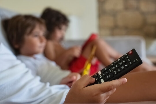 Kid Holding A Tv Remote Control 