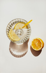 Summer lemonade beverage refreshment photo minimalistic top view with a lemon slice in bright...