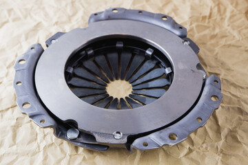 Passenger car clutch basket. Photo of a new clutch before installation on a car on a background of...