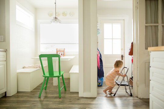 Young girl gets step stool