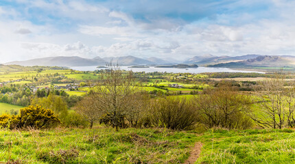 Obraz premium A panorama view towards Loch Lomond from Dumpling Hill, Gartocharn, Scotland on a summers day