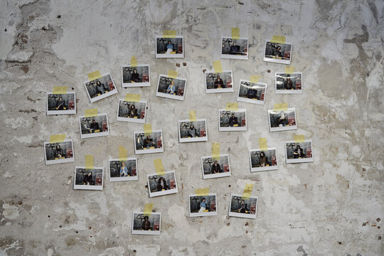 Polaroid Photos Of People On Wall