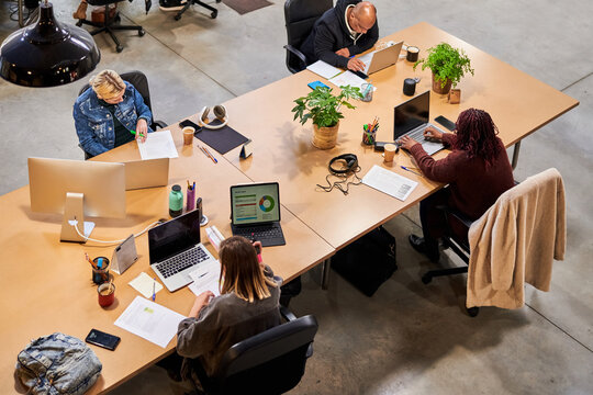 Diverse coworkers working with data