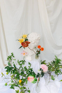 statue with flowers around