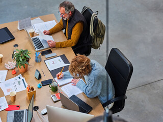 Company employees working with reports