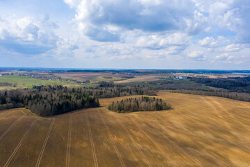 Aerial view of agricultural landscape with fields in spring season.