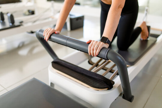 Woman Does Pilates Exercise 