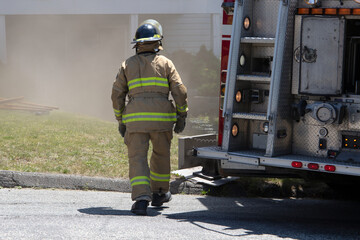 fire extinguisher firefighter department working under smoke