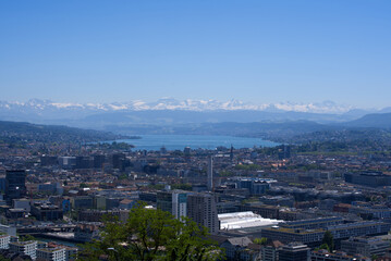 Panorama view over the City of Zurich with lake Zurich and Swiss alps in the background at a beautiful summer day. Photo taken June 14th, 2021, Zurich, Switzerland.