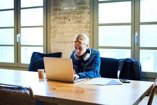 Employee working on laptop.