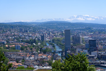 Obraz premium Panorama view over the City of Zurich with river Limmat and Swiss alps in the background at a beautiful summer day. Photo taken June 14th, 2021, Zurich, Switzerland.