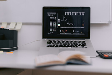 Laptop with trading diagram on screen