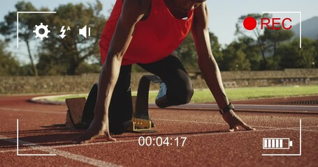 Animation of camera digital interface over disabled male athlete on racing track - Powered by Adobe