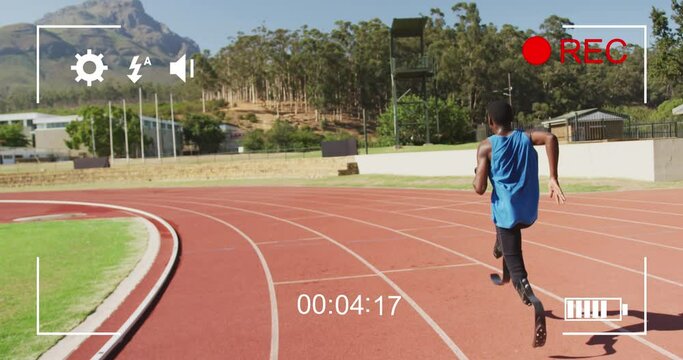 Animation of digital data processing over disabled male athlete with running blades on racing track