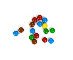 Round candies on a white background, scattered candies. Colorful round candies isolated.