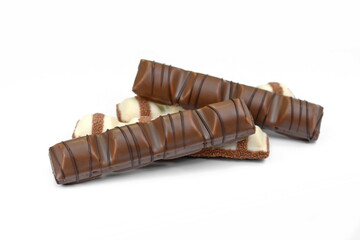 White Chocolate Bar and black chocolate bar with soft hazelnut filling isolated on white background.