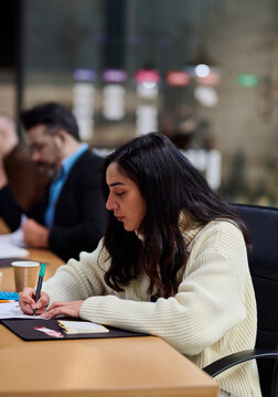 Female trainee making notes 