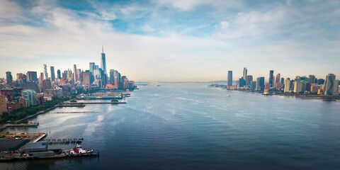 New York and New Jersey separated with Hudson river and Manhatn skyline rising above aerial view - 439390550