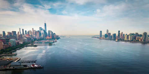 Fototapeten New York and New Jersey separated with Hudson river and Manhatn skyline rising above aerial view © creativefamily