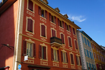 Fototapeta na wymiar colorful facade of buildings downtown Barcelonnette, France