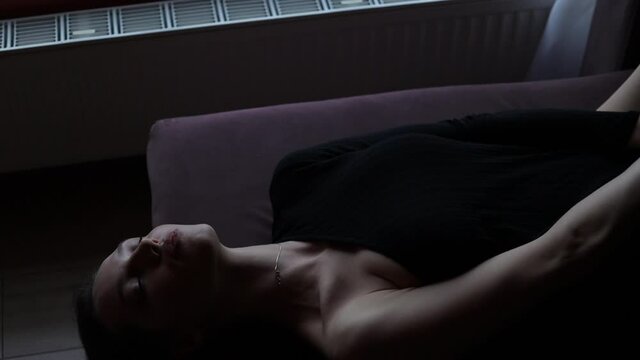 Graceful woman in sexy dress at home