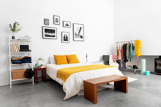 Spacious bedroom with minimalist furniture