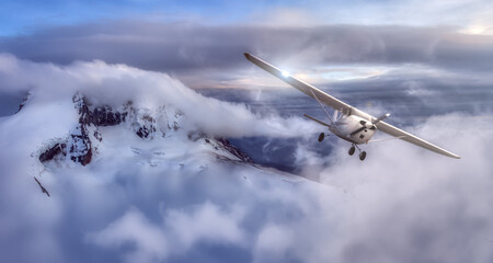 Airplane flying near the Beautiful Canadian Mountain Nature Landscape. Adventure Composite. Cloudy Sunset Sky. Background from near Squamish and Vancouver, British Columbia, Canada.