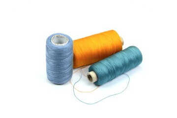 Color sewing threads isolated on white background.