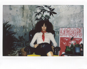 Mixed race woman sitting in armchair