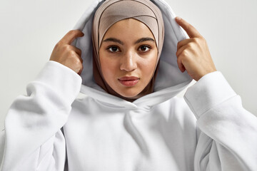 Portrait of beautiful young arabian girl in traditional hijab