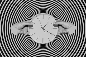 Male hands holding a clock