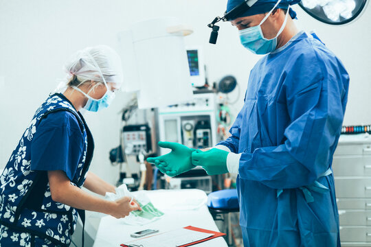 Surgeon And Nurse In PPE