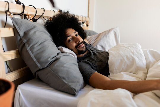 portrait of a man relaxed on bed