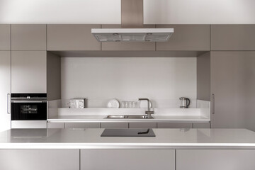 Interior of modern kitchen with white walls