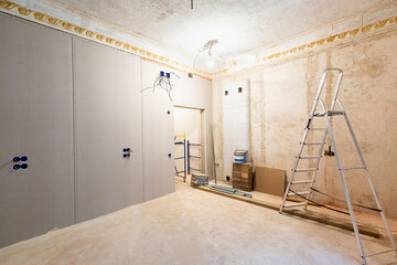 Working process of installing gypsum walls from plasterboard -drywall - in apartment is under...