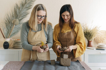 Two Women Work In A Ceramic Workshop