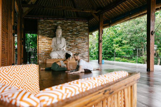 Two People Practicing Yoga Together