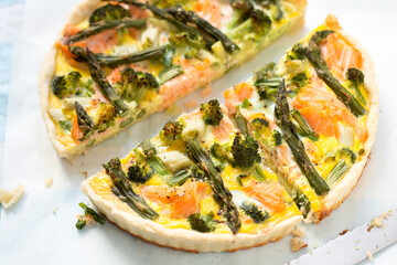 Quiche with salmon, broccoli, green asparagus