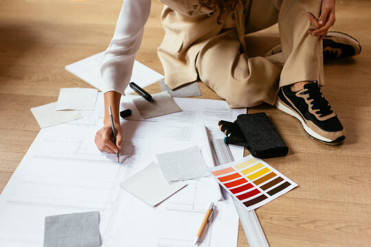 Crop designer creating blueprint on floor