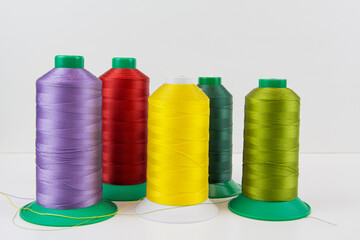 Colorful sewing thread, background, tailor-related images. On a white background.