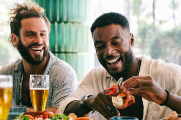 Two Guy Friends Having Fun at Seafood Lunch