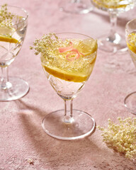 Fresh elder flowers in a glass of lemonade. Herbal or alternative medicine..