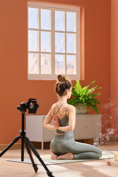 Female doing Reverse Prayer Pose.