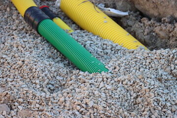 Power electric Cable installation in the double-wall cable conduits. Cable trench installation