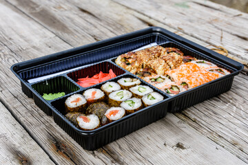 Set of the different sushi on wooden table