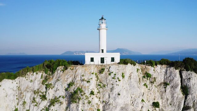 Aerial reveal shot of famous lighthouse of Cape of Ducato at Greek island Lefkada.